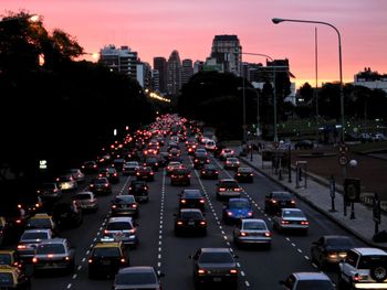 Traffic on city street at dusk