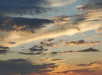 Low angle view of dramatic sky during sunset