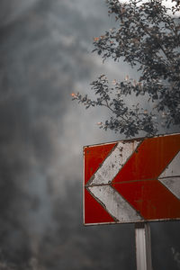 Low angle view of road sign against sky