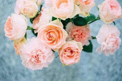 High angle view of roses and carnation flowers in vase