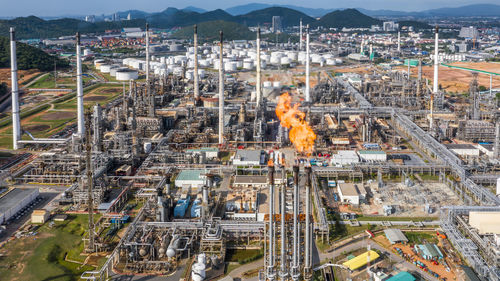 Aerial top view oil and gas refinery petrochemical plant industrial with oil and gas storage tank.