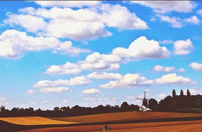 Scenic view of landscape against cloudy sky