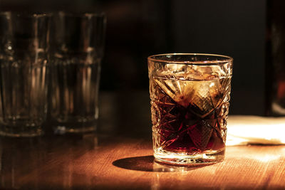 Close-up of beer glass on table