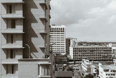 Buildings in city against sky