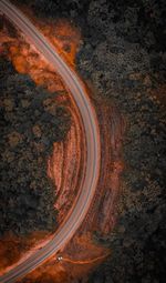 High angle view of road amidst trees against sky