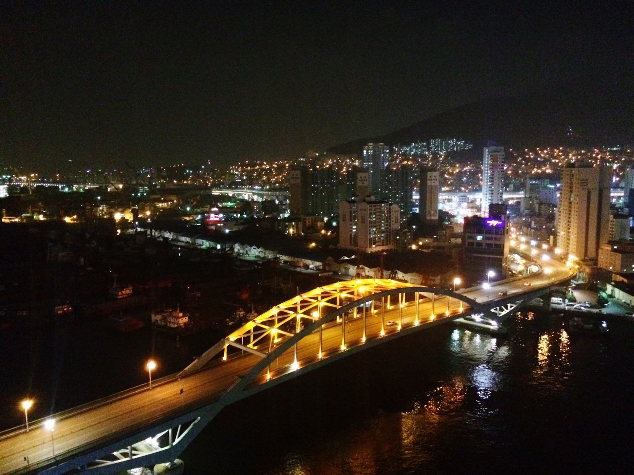 ILLUMINATED CITYSCAPE AT NIGHT