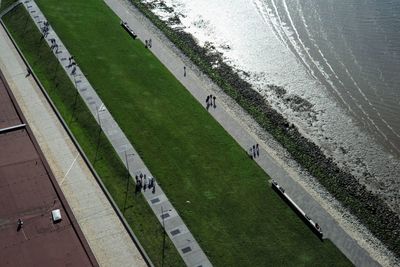 High angle view of street amidst field