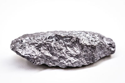 Close-up of rock against white background