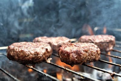 Close-up of meat on barbecue grill