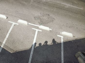 High angle view of arrow sign on road