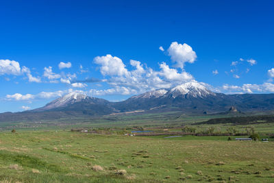 Scenic view of snowcapped mountains against sky