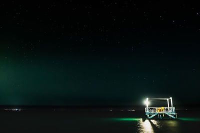 Scenic view of sea against sky at night