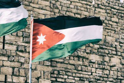 View of flag against brick wall