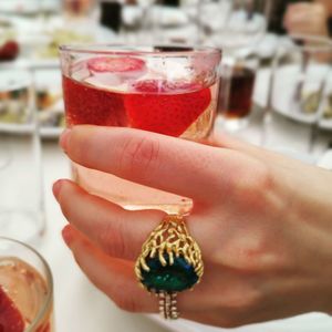 Cropped hand of woman holding drink