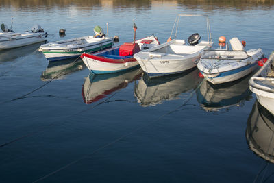 Boats moored in lake