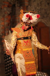 Young woman performing in traditional costume