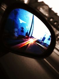 Close-up of car on road