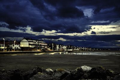 Built structures against cloudy sky