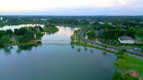 High angle view of river amidst trees against sky
