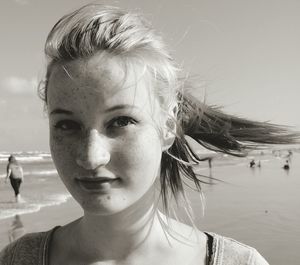 Portrait of young woman in water