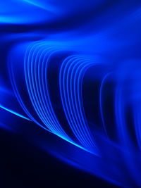 Close-up of light trails over black background