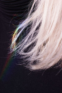 Close-up of person against black background