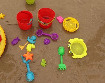 High angle view of various toy on beach