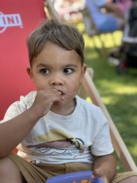 Portrait of cute boy eating food