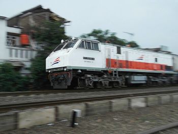 Train on railroad track against sky