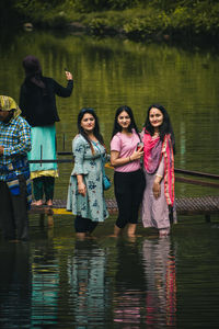 People standing in lake