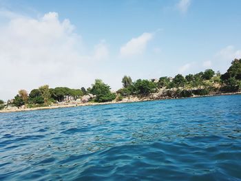 Scenic view of swimming pool by sea against sky