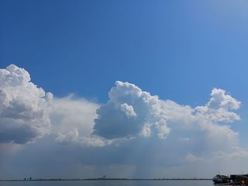 Low angle view of sea against blue sky