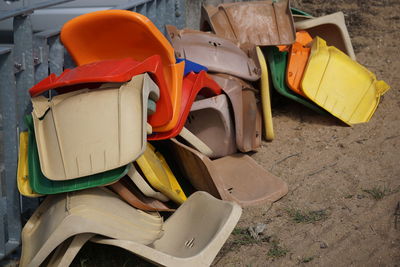 Close-up of multi colored chairs on the beach