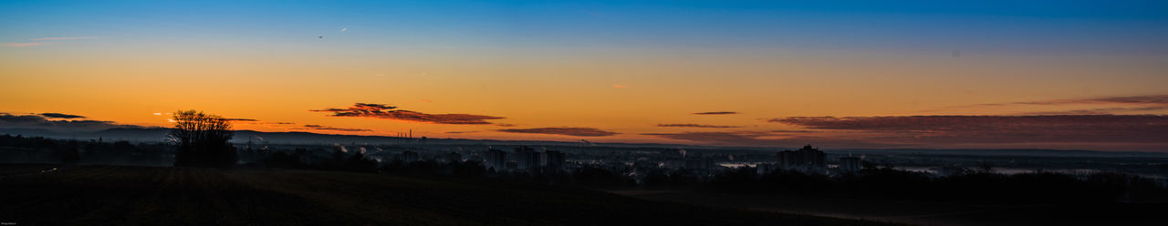 Scenic view of landscape against sky during sunset