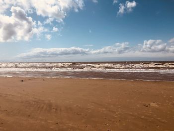 Scenic view of beach against sky