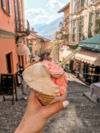 Cropped image of hand holding ice cream cone