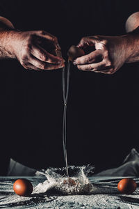 Close-up of man preparing food