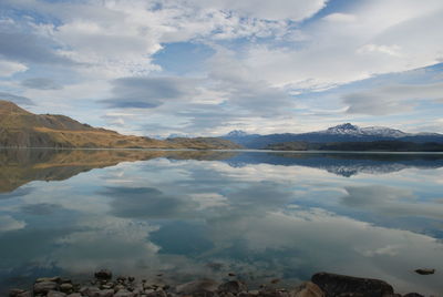 Scenic view of lake and mountains against sky