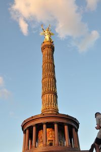 Low angle view of statue of liberty against sky