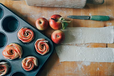 High angle view of fruitcakes on wooden table