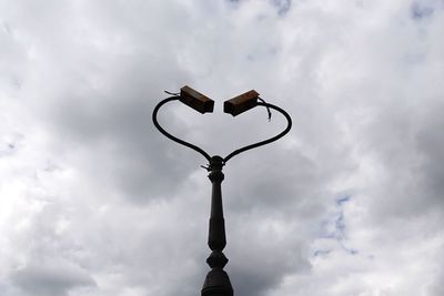 Low angle view of street light against sky