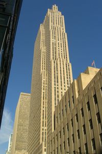 Low angle view of modern building against blue sky