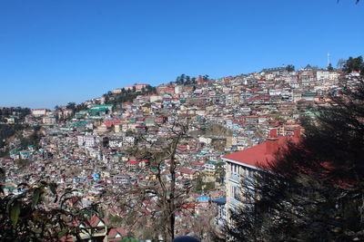 View of buildings against blue sky