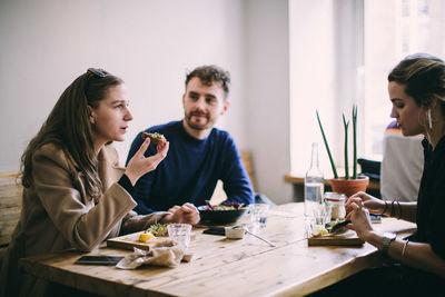 Group of people sitting on table