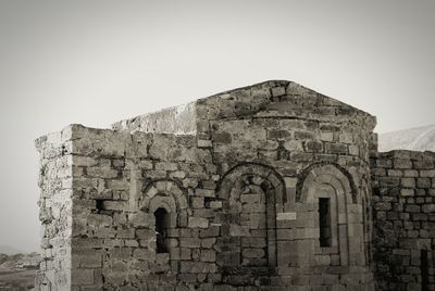 Low angle view of old ruins against clear sky