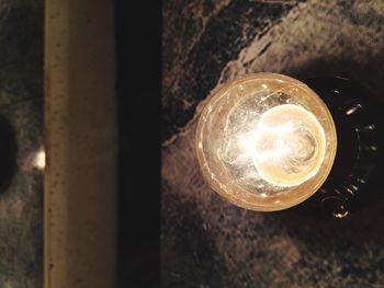Close-up of illuminated light bulb