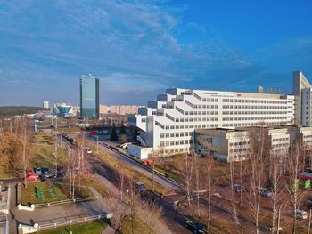 High angle view of street amidst buildings against sky