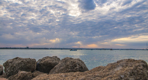 Scenic view of sea against sky at sunset
