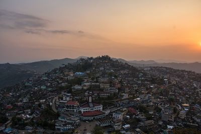 High angle view of city at sunset