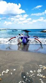 A balinese fisherman docking his boat.